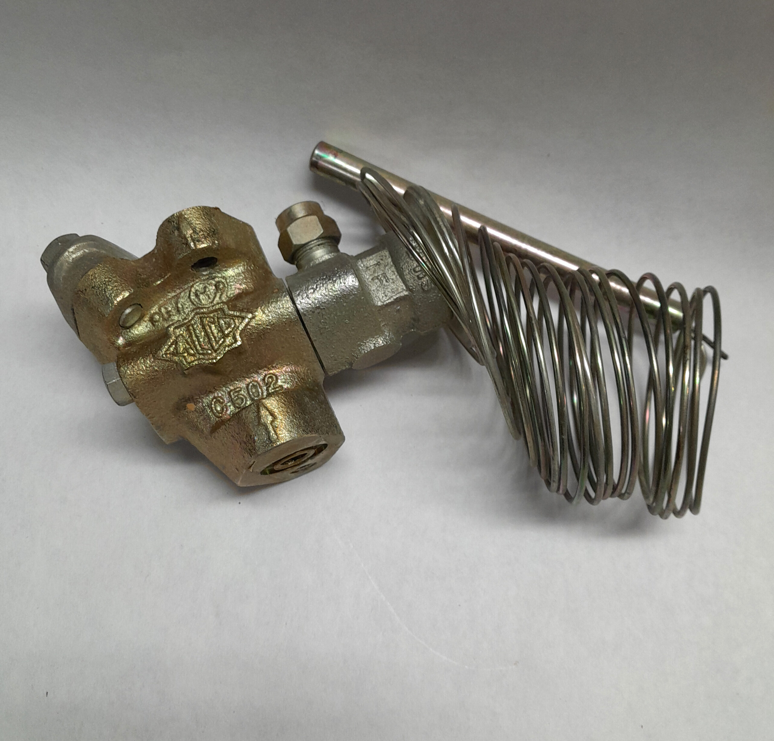 Danfoss thermostatic expansion valve (TEV) with a remote bulb.